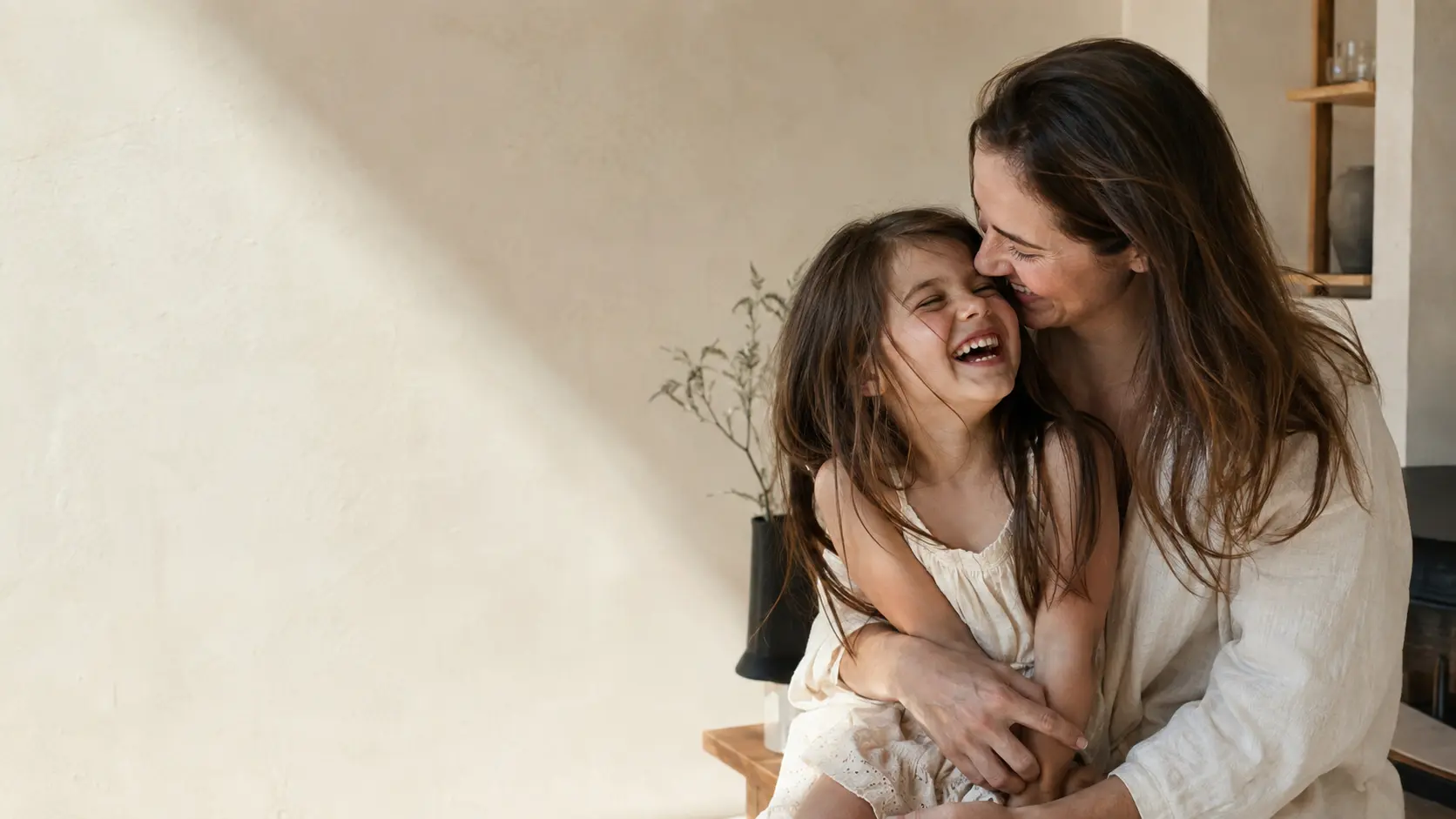 A mother and daughter sharing a candid moment at home